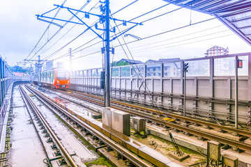 A train running at a subway station.