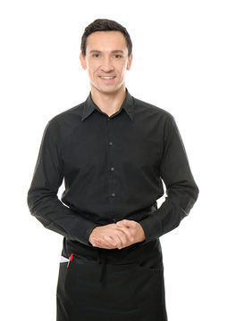 Waiter in black uniform on white background