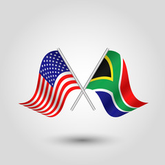 vector two crossed american and african flags on silver sticks - symbol of united states of america and south africa
