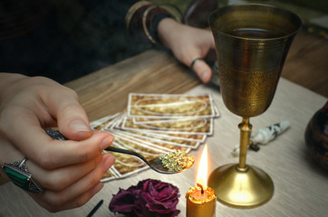 Witchcraft. Magic potion. Tarot cards on fortune teller desk table.