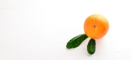 Orange on a wooden background. Top view. Free space for text.