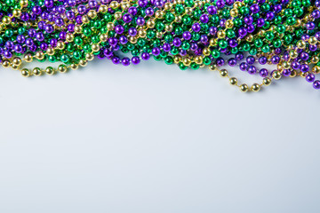 Mardi gras carnival background - beads and mask