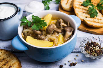 Transparent soup with oyster mushrooms