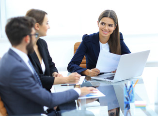 business partners discussing documents and ideas at meeting