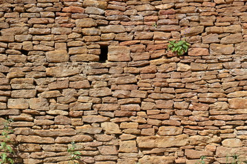 The old bricks of castle wall or ancient ruins. Background