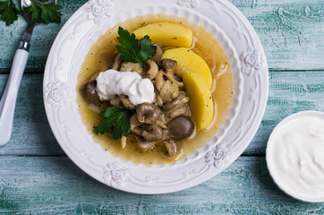 Transparent soup with oyster mushrooms