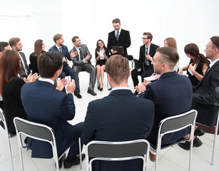Fototapeta premium coach asks questions to the participants of the training.