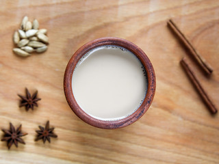 Obraz na płótnie Canvas Indian masala tea with spices and milk