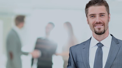 Fototapeta premium Happy mature business man looking at camera with satisfaction at office
