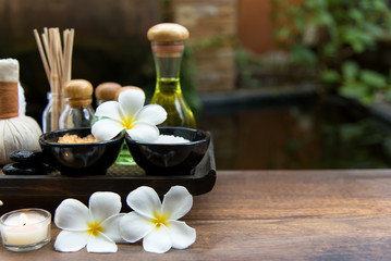 Fototapeta na wymiar Thai Spa massage compress balls, herbal ball and treatment spa, relax and healthy care with flower, Thailand. Healthy Concept. select focus