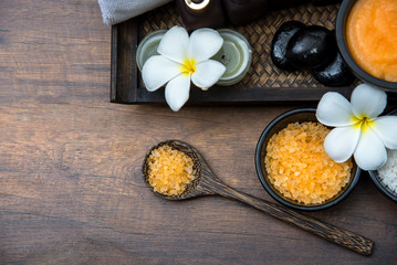 Fototapeta na wymiar Spa Thai setting for aroma therapy and sugar and salt massage with flower on the bed, relax and healthy care. Top vie, copy space. Healthy Concept