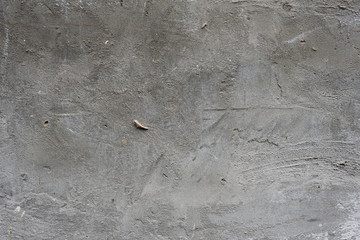 Wall fragment with scratches and cracks