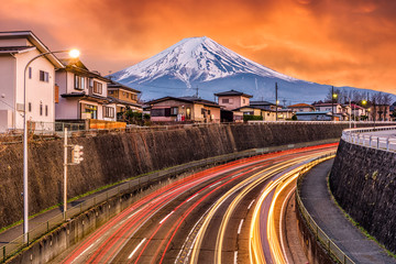 Mt. Fuji, Japan over roads at dusk.