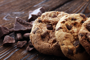 Chocolate cookies on wooden table. Chocolate chip cookies.