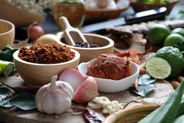 Assortment of Thai food Cooking ingredients. Spices ingredients chilli pepper garlicgalanga and kaffir lime leaves.