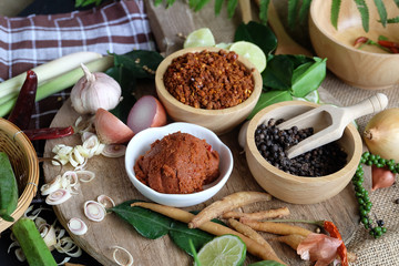 Assortment of Thai food Cooking ingredients. Spices ingredients chilli pepper garlicgalanga and kaffir lime leaves.