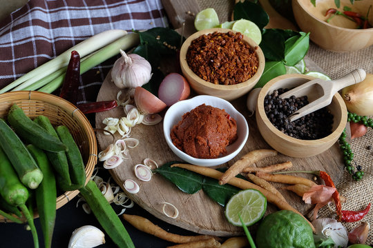 Assortment of Thai food Cooking ingredients. Spices ingredients chilli pepper garlicgalanga and kaffir lime leaves.
