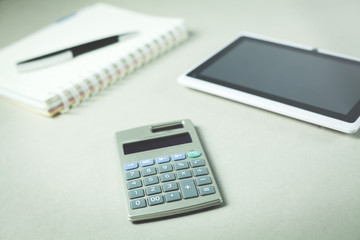 Notepad with tablet and calculator. Business concept.