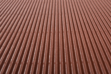 perspective view of cardboard corrugated pattern background at brown color