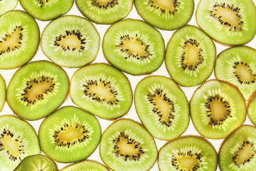 Backlit kiwifruit slices background