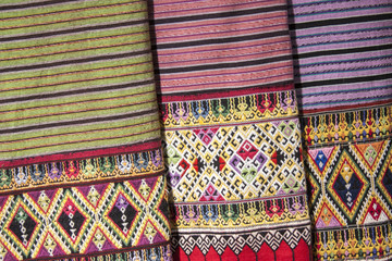 Traditional costumes woven with cotton  / Thailand folk textiles 
Traditional textiles made from natural pigments. a pattern of woven fabric that is unique to Thailand
