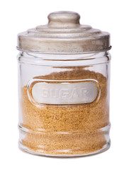 Jar with brown cane sugar isolated on white
