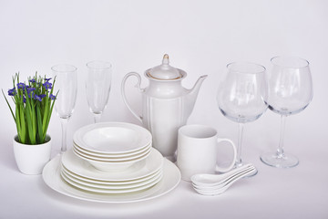 Set of new clean white dishes isolated on white background