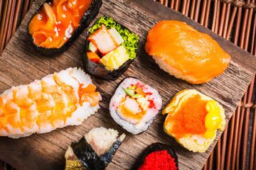 Sushi Set sashimi and sushi rolls served on wood slate.Copy space for your text.,Top view
