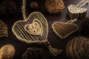 Composition with hearts from twigs on a wooden background. - 185014976