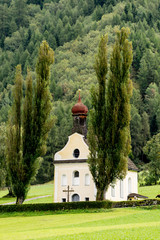 Church on the hill landscape, mountains and peaks in background, natural environment. Austria Alps, Vent, Europe.