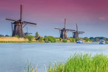 Spectacular windmills in Kinderdijk museum with colorful sunset, Netherlands, Europe