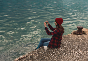 Woman taking pictures with a cellphone