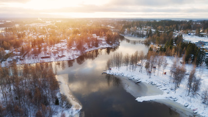Aerial view of the village and river at sunset. Winter  season. Lempaala 