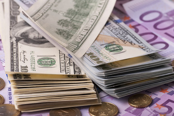 Dollar, euro banknotes and coins