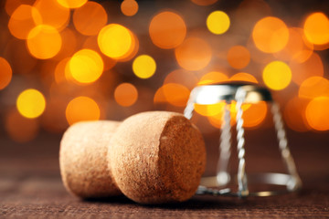 Champagne cork with cap on light background
