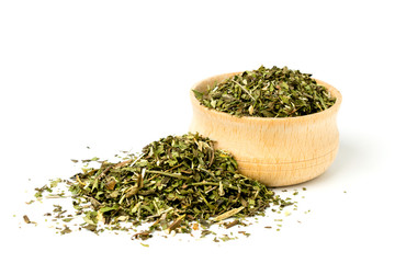 Green tea in wooden plate on white