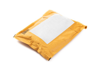 Small paper post packet isolated on the white background