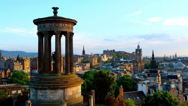 Edinburgh, UK. Calton Hill in Edinburgh, Scotland, UK. Aerial view of the city with Castle and Clock Tower. Day, cloudy sky