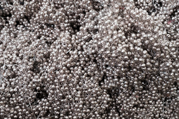Mix of silver beads background. Creative winter wedding decor. Luxury reception style