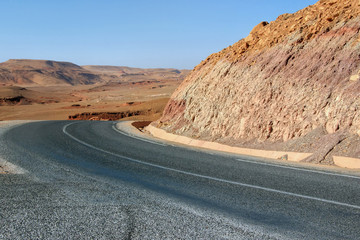 travel on empty highway in desert valley in Sahara desert