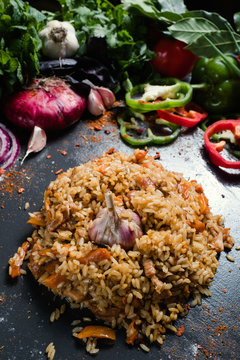 Traditional Uzbek cuisine plov dish vegetable background. Healthy food eating and proper nutrition concept