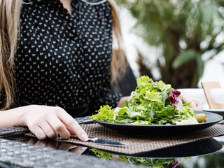 healthy business lunch. Woman having a light dinner at restaurant. Busy lifestyle. Proper nutrition
