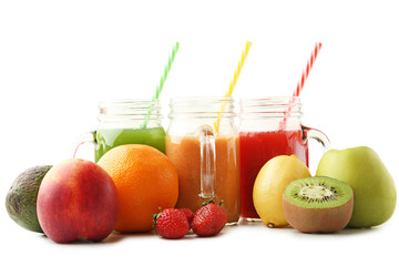 Sweet smoothie in glass jars with fruits on white background