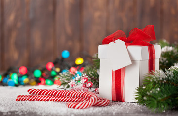 Christmas gift box, candy canes and tree