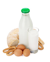 Milk bottle, glass, bread and eggs
