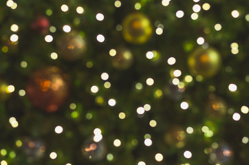 blur and defocused of celebration of decoration lighting on pine tree for merry christmas and happy new year.
