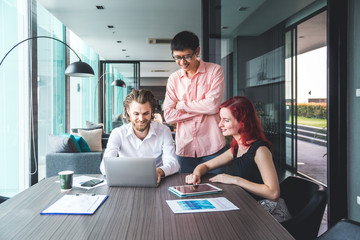 Casual dressed business or student team working together on prosject in modern environment. Casual teamwork, meetup or startup concept. Copy Space.