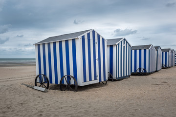 Row of blue and white beach cabins, Sunday 23 July 2017, De Panne, Belgium.