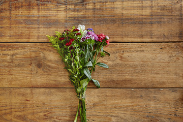 bouquet of wild flowers on wooden table