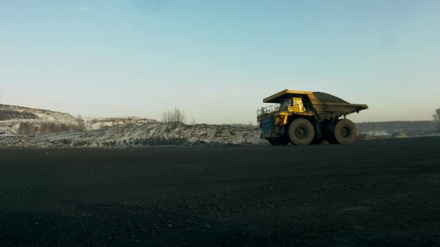 Large multi-ton truck carries coal